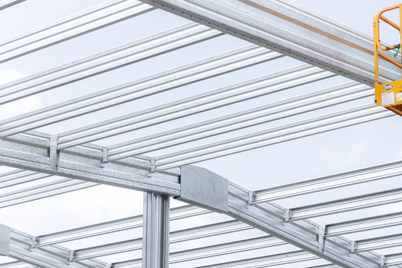 Clear-span interiors, integrated overhead lifting capability, and structural configurations by formsteel advanced technology
